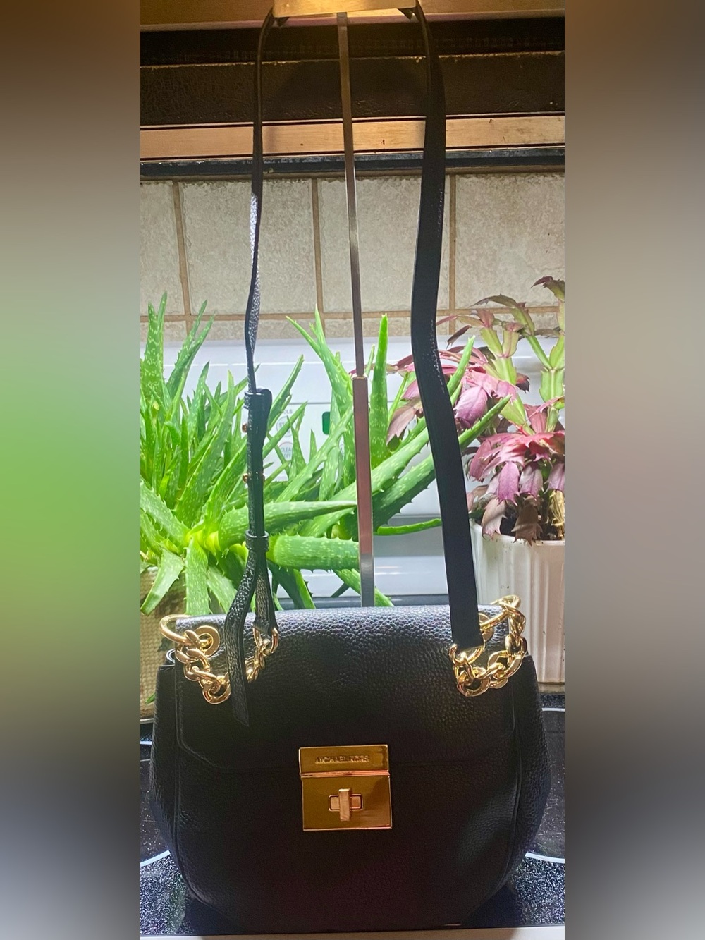 Michael Kors EUC Cecelia pebbled leather saddle bag with turn-lock closure